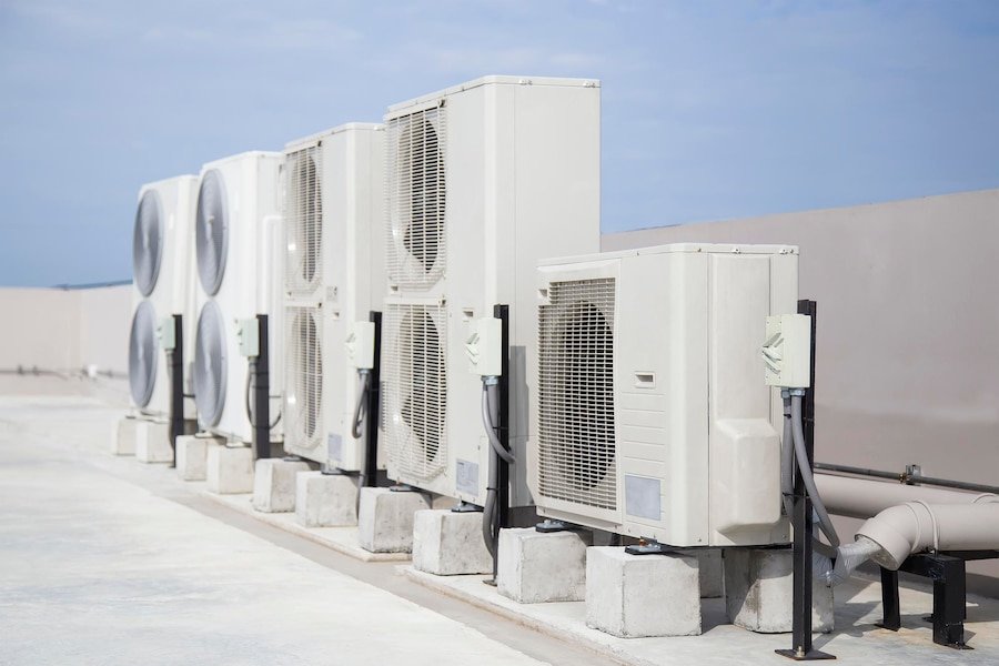 air conditioning hvac roof industrial building with blue sky clouds 539854 1358